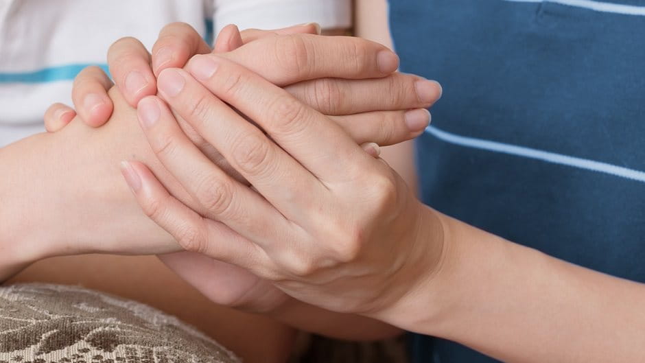 Rewards & Benefits Career - close up of two peoples hands, holding each other